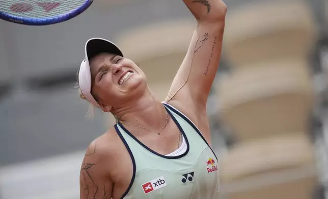Marketa Vondrousova of the Czech Republic reacts as she plays Jessica Pegula of the U.S. during their third round match of the French Tennis Open, at the Roland-Garros stadium, in Paris, Saturday, May 31, 2025. (AP Photo/Christophe Ena)