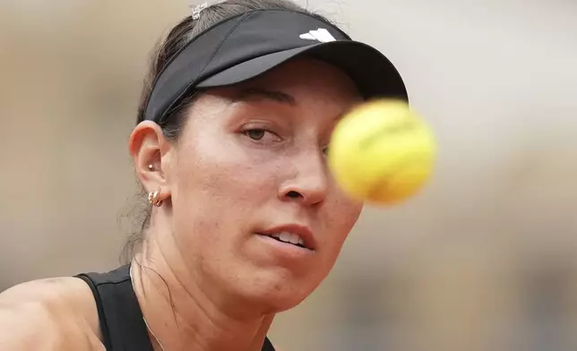 Jessica Pegula of the U.S. eyes the ball as she plays Marketa Vondrousova of the Czech Republic during their third round match of the French Tennis Open, at the Roland-Garros stadium, in Paris, Saturday, May 31, 2025. (AP Photo/Christophe Ena)