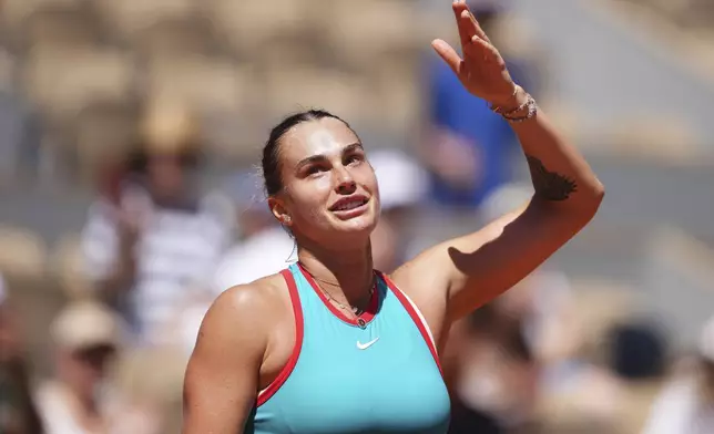 Aryna Sabalenka of Belarus celebrates beating Serbia's Olga Danilovic during their third round match of the French Tennis Open, at the Roland-Garros stadium, in Paris, Friday, May 30, 2025. (AP Photo/Lindsey Wasson)
