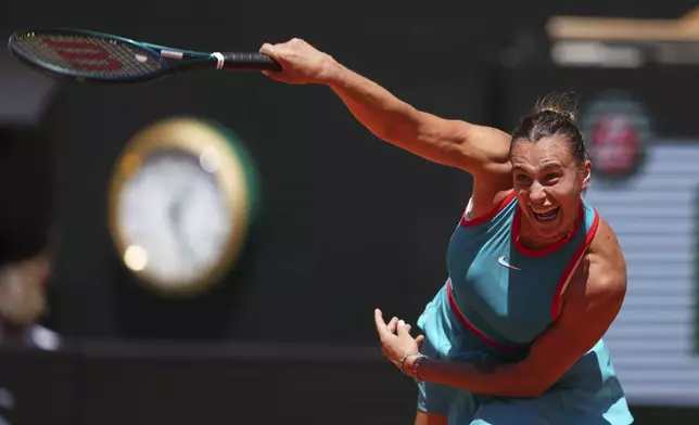 Aryna Sabalenka of Belarus serves against Serbia's Olga Danilovic during their third round match of the French Tennis Open, at the Roland-Garros stadium, in Paris, Friday, May 30, 2025. (AP Photo/Lindsey Wasson)