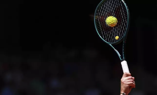 France's Quentin Halys serves against Denmark's Holger Rune during their third round match of the French Tennis Open, at the Roland-Garros stadium, in Paris, Friday, May 30, 2025. (AP Photo/Lindsey Wasson)
