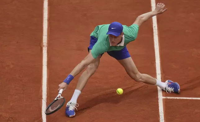 Italy's Jannik Sinner returns the ball to Jiri Lehecka of the Czech Republic during their third round match of the French Tennis Open, at the Roland-Garros stadium, in Paris, Saturday, May 31, 2025. (AP Photo/Thibault Camus)