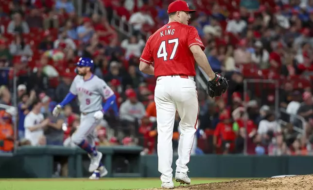 St. Louis Cardinals pitcher John King (47) walks back to the top of the mound after giving up a solo home run to New York Mets' Brandon Nimmo (9) during the seventh inning of a baseball game Friday, May 2, 2025, in St. Louis. (AP Photo/Scott Kane)