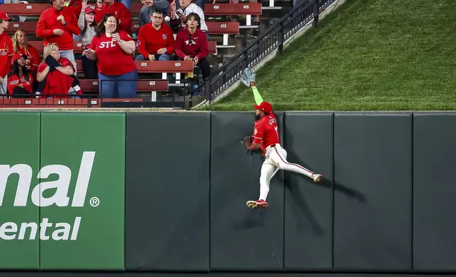 St. Louis Cardinals' Victor Scott II is unable to catch a two-run home run by New York Mets' Pete Alonso during the fifth inning of a baseball game Friday, May 2, 2025, in St. Louis. (AP Photo/Scott Kane)