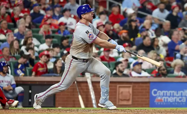 New York Mets' Pete Alonso watches his two-run home run during the fifth inning of a baseball game against the St. Louis Cardinals, Friday, May 2, 2025, in St. Louis. (AP Photo/Scott Kane)