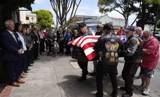 Members of the Patriot Guard Riders carry the casket, Friday, May 23, 2025, in San Leandro, Calif., containing the remains of U.S. Army Air Forces 2nd Lt. Thomas Kelly, who had been missing since being killed when the World War II bomber nicknamed Heaven Can Wait was hit by anti-aircraft fire and crashed into the water off the coast of Papua New Guinea on March 11, 1944. (AP Photo/Godofredo A. Vásquez)