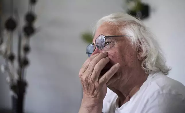 Ben Buitenhuis, a 83-year-old surivor of the 1944-1945 Hunger Winter, reacts during an interview in Delft, Netherlands, Tuesday, April 29, 2025. (AP Photo/Peter Dejong)