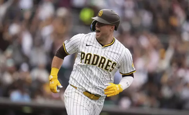 San Diego Padres' Gavin Sheets celebrates his two-run home run during the seventh inning of a baseball game against the Miami Marlins Wednesday, May 28, 2025, in San Diego. (AP Photo/Gregory Bull)