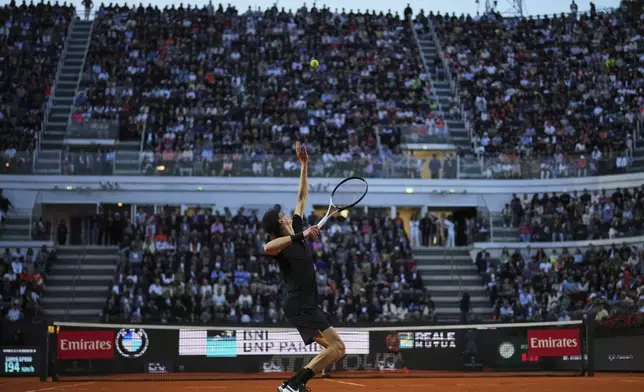 Italy's Jannik Sinner serves against Argentina's Mariano Navone during a second round match at the Italian Open tennis tournament in Rome, Saturday, May 10, 2025. (AP Photo/Andrew Medichini)