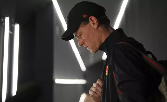 Italy's Jannik Sinner looks down upon his arrival for the second round match against Argentina's Mariano Navone, at the Italian Open tennis tournament in Rome, Saturday, May 10, 2025. (AP Photo/Andrew Medichini)