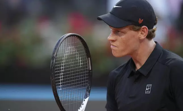 Italy's Jannik Sinner reacts after scoring a point against Argentina's Mariano Navone during a second round match at the Italian Open tennis tournament in Rome, Saturday, May 10, 2025. (AP Photo/Andrew Medichini)