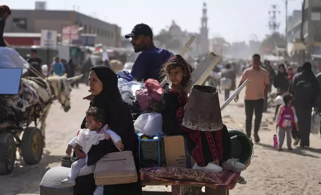 Displaced Palestinians flee from Khan Younis, Gaza, amid the ongoing Israeli military offensive in the area, on Monday, May 19, 2025. (AP Photo/Abdel Kareem Hana)
