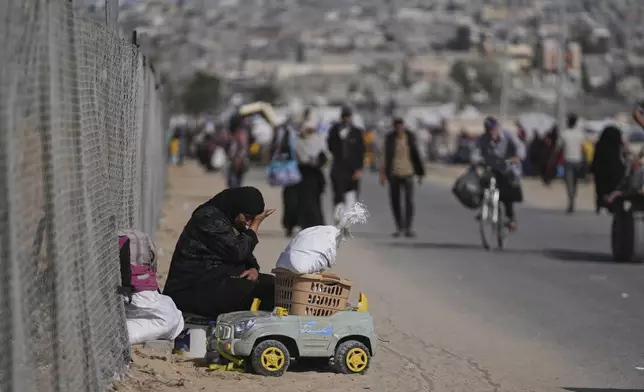 Displaced Palestinians flee from Khan Younis, Gaza, amid the ongoing Israeli military offensive in the area, on Monday, May 19, 2025. (AP Photo/Abdel Kareem Hana)