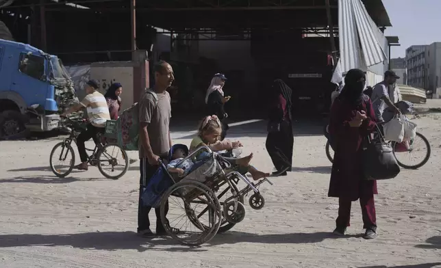 Displaced Palestinians flee from Khan Younis, Gaza, amid the ongoing Israeli military offensive in the area, on Monday, May 19, 2025. (AP Photo/Abdel Kareem Hana)