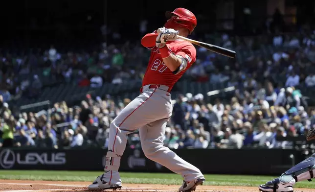 Los Angeles Angels' Mike Trout hits a single against the Seattle Mariners during the first inning of a baseball game, Wednesday, April 30, 2025, in Seattle. (AP Photo/John Froschauer)