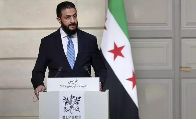 Syria's interim President Ahmad al-Sharaa, speaks during a joint press conference with French President Emmanuel Macron after a meeting at the Elysee Palace in Paris, Wednesday, May 7, 2025. (Stephanie Lecocq/Pool via AP)