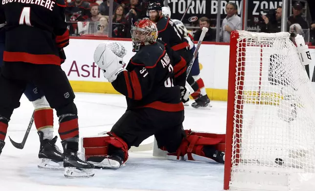Carolina Hurricanes goaltender Frederik Andersen (31) turns as the puck shot by the Florida Panthers gets into the goal during the first period of Game 1 of the NHL hockey Stanley Cup Eastern Conference finals in Raleigh, N.C., Tuesday, May 20, 2025. (AP Photo/Karl DeBlaker)