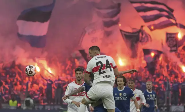 Stuttgart's Jeff Chabot heads the ball during the German soccer cup, DFB Pokal, final match between Arminia Bielefeld and VfB Stuttgart at Olympiastadion in Berlin, Germany, Saturday, May 24, 2025. (AP Photo/Matthias Schrader)