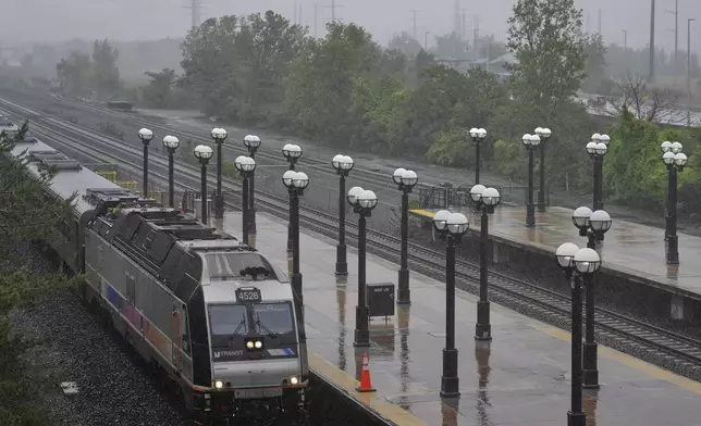 An NJ Transit train pulls into the Secaucus Junction station in Secaucus, N.J., Wednesday, May 14, 2025. (AP Photo/Seth Wenig)