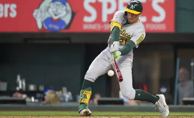 Oakland Athletics' Tyler Soderstrom swings at a pitch from the Texas Rangers during the sixth inning of a baseball game Thursday, May 1, 2025, in Arlington, TX. (AP Photo/Julio Cortez)