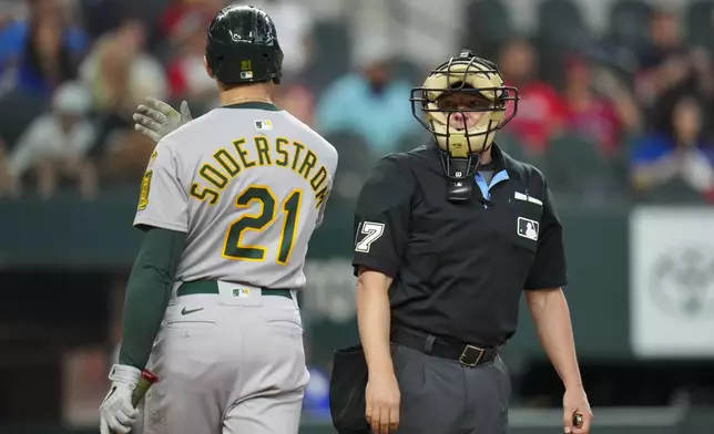 Oakland Athletics' Tyler Soderstrom (21) reacts after being called out on strikes by home plate umpire DJ Reyburn during the ninth inning of a baseball game against the Texas Rangers Thursday, May 1, 2025, in Arlington, TX. (AP Photo/Julio Cortez)