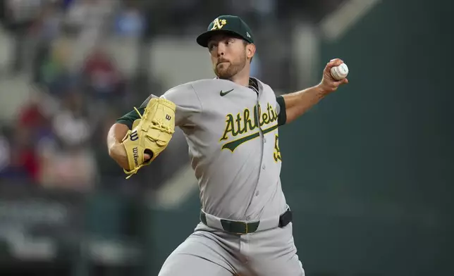 Oakland Athletics starting pitcher Jeffrey Springs throws a pitch to the Texas Rangers during the first inning of a baseball game Thursday, May 1, 2025, in Arlington, TX. (AP Photo/Julio Cortez)