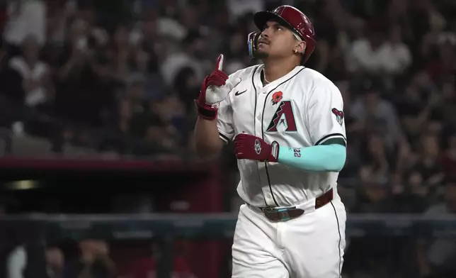 Arizona Diamondbacks' Josh Naylor celebrates after hitting a two-run home run against the Pittsburgh Pirates in the fifth inning during a baseball game, Monday, May 26, 2025, in Phoenix. (AP Photo/Rick Scuteri)