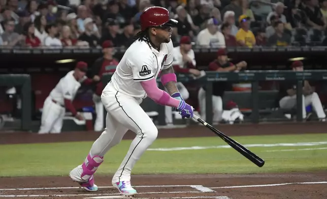 Arizona Diamondbacks' Ketel Marte hits a single against the Pittsburgh Pirates in the first inning during a baseball game, Monday, May 26, 2025, in Phoenix. (AP Photo/Rick Scuteri)