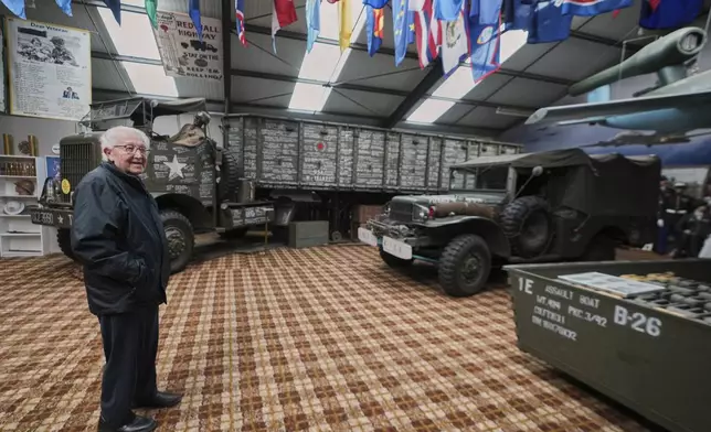 Director of the WWII Remember Museum 1939-1945, Marcel Schmetz, stands near vintage WWII vehicles inside his museum in Thimister-Clermont, Belgium, April 22, 2025. (AP Photo/Virginia Mayo)