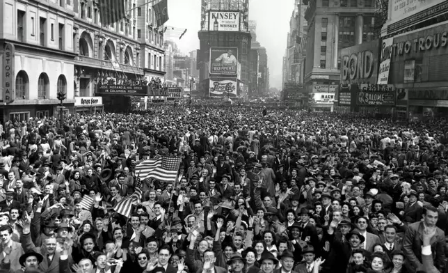 FILE - Looking north from 44th Street, New York's Times Square is packed Monday, May 7, 1945, with crowds celebrating the news of Germany's unconditional surrender in World War II. (AP Photo/Tom Fitzsimmons, File)