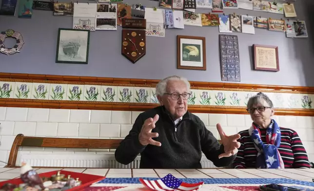 Directors of the WWII Remember Museum 1939-1945, Marcel Schmetz, left, and his wife Mathilde Schmetz speak during an interview at their museum in Thimister-Clermont, Belgium, April 22, 2025. (AP Photo/Virginia Mayo)