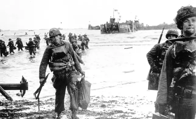 FILE - Carrying full equipment, American assault troops move onto a beachhead code-named Omaha Beach, on the northern coast of France on June 6, 1944, during the Allied invasion of the Normandy coast. (U.S. Army via AP, File)