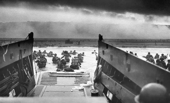 FILE - This photograph is believed to show E Company, 16th Regiment, 1st Infantry Division, participating in the first wave of assaults during D-Day in Normandy, France, June 6, 1944. (Chief Photographer's Mate Robert M. Sargent, U.S. Coast Guard via AP, File)