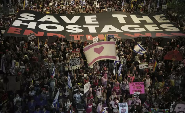 People take part in a protest demanding the end of the war and immediate release of hostages held by Hamas in the Gaza Strip, and against Prime Minister Benjamin Netanyahu's government in Tel Aviv, Israel, Saturday, May 24, 2025. (AP Photo/Leo Correa)