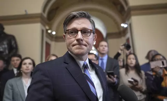 FILE - Speaker of the House Mike Johnson, R-La., talks to reporters just after House Republicans narrowly approved their budget framework, at the Capitol in Washington, April 10, 2025. (AP Photo/J. Scott Applewhite, File)