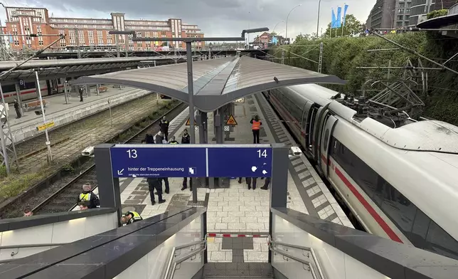 Police at the scene of a stabbing at Hamburg Central Station in Hamburg, Germany, Friday, May 23, 2025. (Steven Hutchings/dpa via AP)