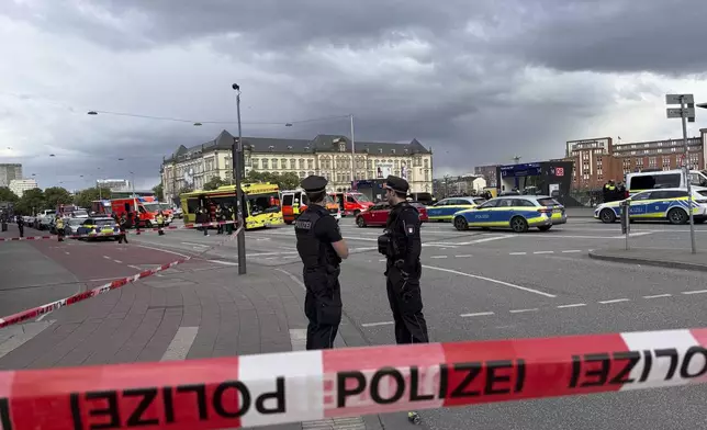 Police near the scene of a stabbing at Hamburg Central Station in Hamburg, Germany, Friday, May 23, 2025. (Steven Hutchings/dpa via AP)