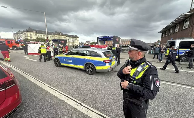 Police at the scene of a stabbing at Hamburg Central Station in Hamburg, Germany, Friday, May 23, 2025. (Steven Hutchings/dpa via AP)