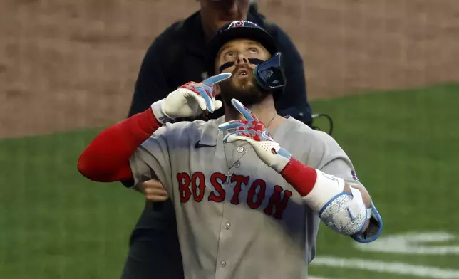 Boston Red Sox's Trevor Story reacts after hitting a two-run home run during the fourth inning of a baseball game against the Atlanta Braves, Friday, May 30, 2025, in Atlanta. (AP Photo/Butch Dill)