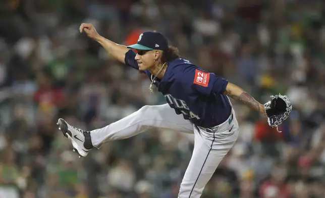Seattle Mariners pitcher Carlos Vargas follows through after delivering a pitch to an Athletics batter during the sixth inning of a baseball game Monday, May 5, 2025, in West Sacramento, Calif. (AP Photo/Scott Marshall)