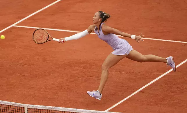 China's Zheng Qinwen returns the ball to Colombia's Emiliana Arango during their second round match of the French Tennis Open, at the Roland-Garros stadium, in Paris, Wednesday, May 28, 2025. (AP Photo/Lindsey Wasson)
