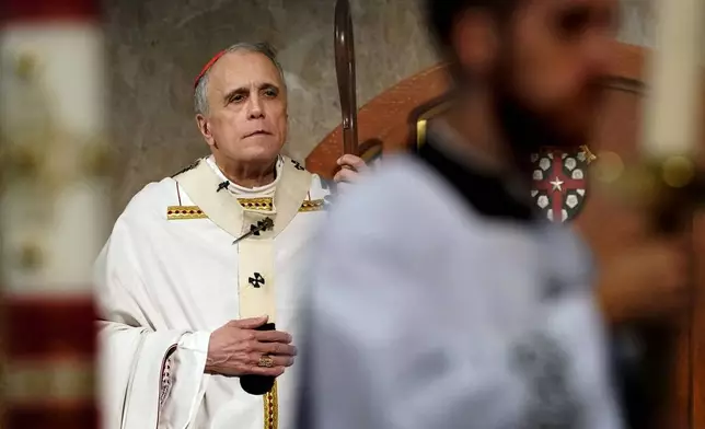 FILE - Cardinal Daniel DiNardo presides over a Mass of Ordination for seven candidates for the priesthood at the Co-Cathedral of the Sacred Heart in Houston, June 1, 2019. (AP Photo/David J. Phillip, File)