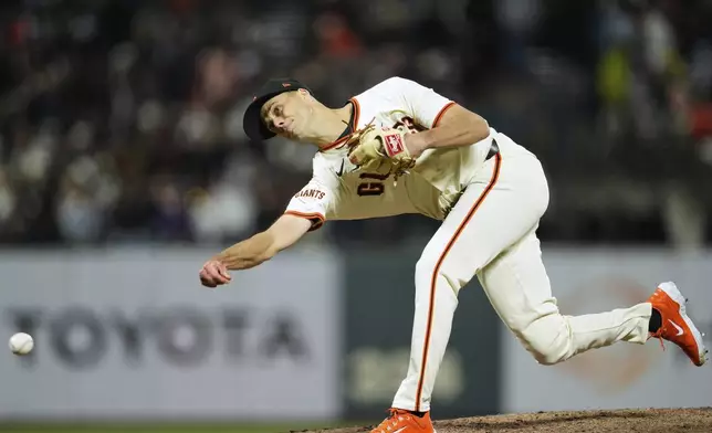 San Francisco Giants pitcher Tyler Rogers throws to a Colorado Rockies batter during the eighth inning of a baseball game Thursday, May 1, 2025, in San Francisco. (AP Photo/Godofredo A. Vásquez)