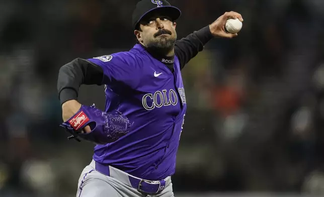 Colorado Rockies pitcher Scott Alexander throws to a San Francisco Giants batter during the eighth inning of a baseball game Thursday, May 1, 2025, in San Francisco. (AP Photo/Godofredo A. Vásquez)
