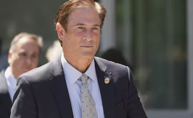 Los Angeles County District Attorney Nathan Hochman walks out of the courthouse after a hearing in the case of Erik and Lyle Menendez Friday, May 9, 2025, in Los Angeles. (AP Photo/Jae C. Hong)