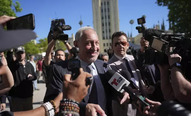 Attorney Mark Geragos, a lawyer for Erik and Lyle Menendez, who were convicted of killing their parents in 1989, speaks to reporters as he arrives to court Friday, May 9, 2025, in Los Angeles. (AP Photo/Jae C. Hong)