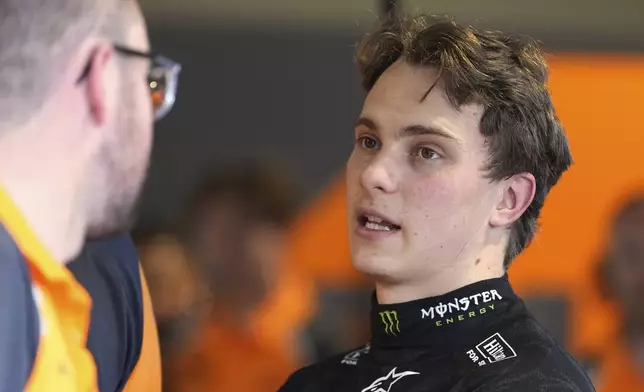 McLaren driver Oscar Piastri of Australia talks with his team after a practice session for the Formula One Miami Grand Prix auto race, Friday, May 2, 2025, in Miami Gardens, Fla. (AP Photo/Rebecca Blackwell)