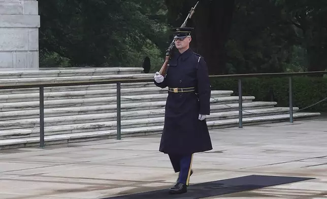 Army Sgt. 1st Class Andrew Jay patrols the Tomb of the Unknown Soldier, Thursday, May 15, 2025, at Arlington National Cemetery in Arlington, Va. (AP Photo/Mike Pesoli)