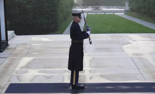 Army Sgt. 1st Class Andrew Jay patrols the Tomb of the Unknown Soldier, Thursday, May 15, 2025, at Arlington National Cemetery in Arlington, Va. (AP Photo/Mike Pesoli)