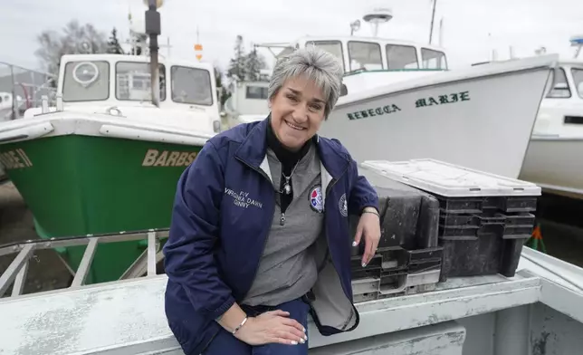 Commercial lobster fisherman Virginia Olsen sits for a portrait in Stonington, Maine, on Friday, May 2, 2025. (AP Photo/Robert F. Bukaty)